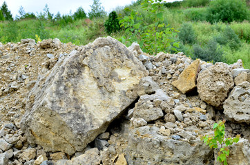 Natural stone dolomite in the limestone open-pit. Building materials, wall background, texture