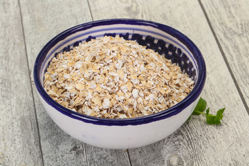 Raw oats in the bowl