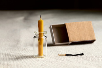In a dark room on the table is an extinct candle. Empty a matchbox and last match burned to...