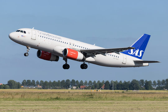 VIJFHUIZEN, THE NETHERLANDS - June 27, 2019: SAS Scandianvian Airlines Airbus A320-200 with registration OY-KAT taking off runway 36L (Polderbaan) of Amsterdam Airport Schiphol.