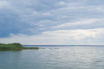 Landscape with lake and blue sky.