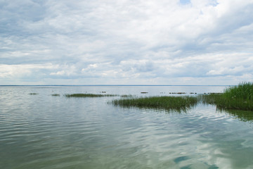 Landscape with lake and blue sky.