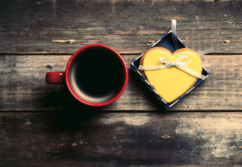 cup of coffee and cookie in the box