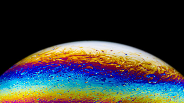 Abstract psychedelic multicolor planet  closeup picture of soap bubble