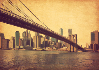 Brooklyn Bridge and Lower Manhattan  in New York City, United States. Photo in retro style. Added paper texture.