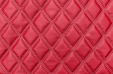 Red leather texture with stitched rhombuses