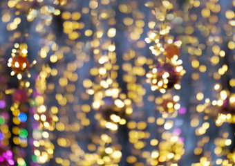 Fototapeta na wymiar Multi-colored street lanterns blurred background, holiday concept.