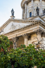 Fototapeta premium The New Church ,Neue Kirche, Deutscher Dom is located in Berlin on the Gendarmenmarkt across from French Church of Friedrichstadt