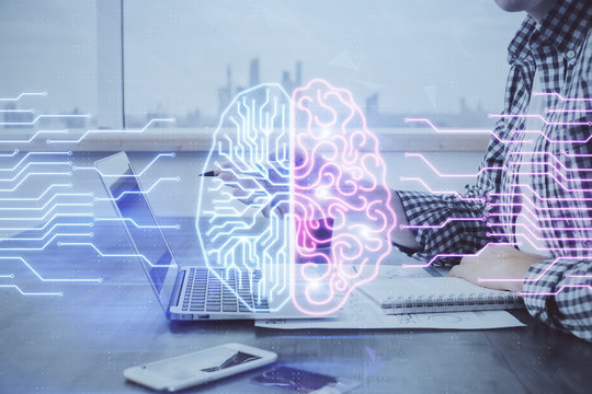 Man typing on keyboard background with brain hologram. Concept of big Data. Double exposure.