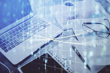 Double exposure of table with computer on background and data theme drawing. Concept of innovation.