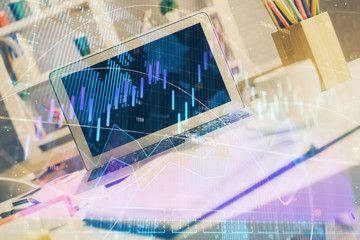 Forex market chart hologram and personal computer background. Double exposure. Concept of investment.