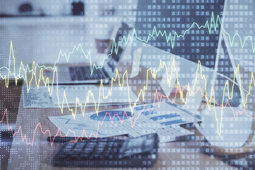 Double exposure of forex chart and work space with computer. Concept of international online trading.