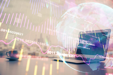 Double exposure of forex chart and work space with computer. Concept of international online trading.