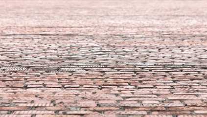 View on a brick wall of building. Perspective of brick background