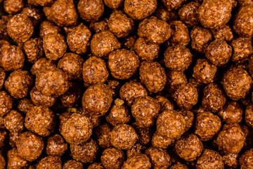 Texture of chocolate cereal balls for the background