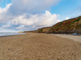 The soft sandy cliffs on Happisburgh beach on the Norfolk coast are being constantly eroded by the...