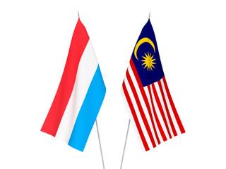 National fabric flags of Malaysia and Luxembourg isolated on white background. 3d rendering illustration.