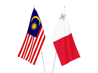 National fabric flags of Malta and Malaysia isolated on white background. 3d rendering illustration.