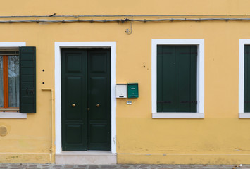 Fototapeta na wymiar Yellow facade house entrance