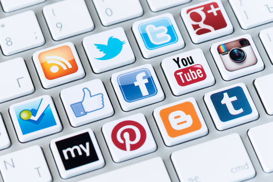 Kiev, Ukraine - May 20, 2013: A social media logotypes collection of well-known social network brand are placed on a modern computer keyboard. 