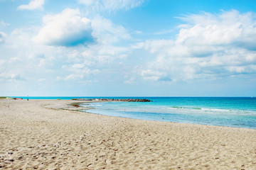 Beautiful seascape with sandy beach and beautiful cloudy sky. Nature. Relaxation.