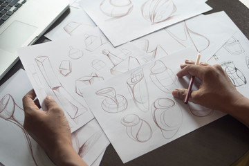 Production designer sketching Drawing Development Design product packaging prototype idea Creative...