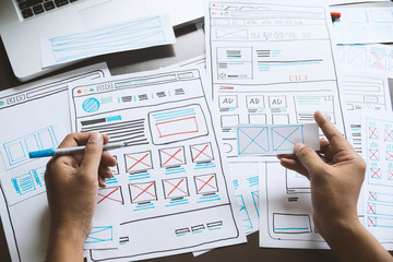 Website designer Creative planning application developer development draft sketch drawing template layout prototype framework wireframe design studio . User experience concept .