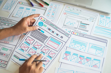 Website designer Creative planning application developer development draft sketch drawing template layout prototype framework wireframe design studio . User experience concept .