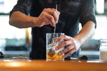 Bartender mixing cocktail