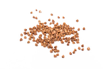 Pile of buckwheat isolated on white background. Top view.