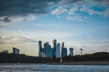 Beautiful view of the skyscrapers of the business center of Moscow city and the Moscow river at sunset. Business center in Russia