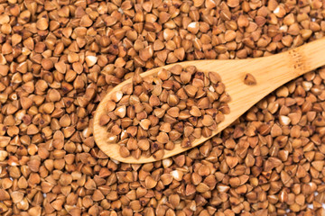 organic raw buckwheat isolated on white background.