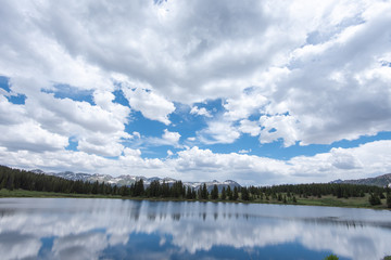 Obraz premium Clouds reflected in Little Molas Lake in the San Juan Mountains of Colorado