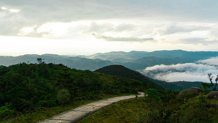 Fototapeta premium road in the mountains above tke clouds