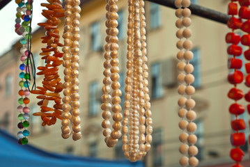 Necklace of colorful stones on the table. Many different jewelry and beads made of natural precious...