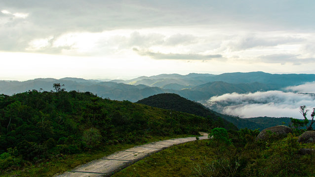 road in the mountains above tke clouds