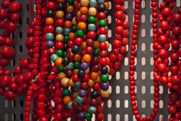 Necklace of colorful stones on the table. Many different jewelry and beads made of natural precious minerals. Jewelry is sold at the fair.