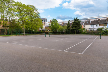 Fototapeta premium Empty tennis courts in a park on a spring day