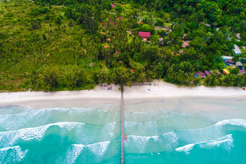 Tropical sea wave white sand beach with green tree aerial view in Koh Kood