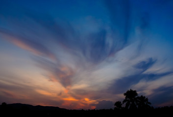 Morning sky with clouds with silhouette tree and mountain background