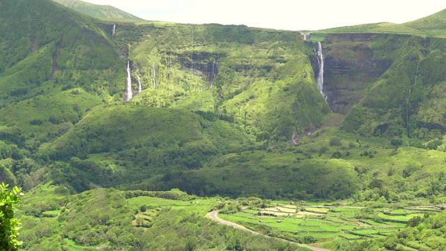 Waterfalls Poco Ribeira do Ferreiro / Alagoinha in the mountains flowing into a lake, Poco das Patas, between Faja Grande and Fajazinha, Island of Flores, Azores, Portugal, Europe, Atlantic Ocean