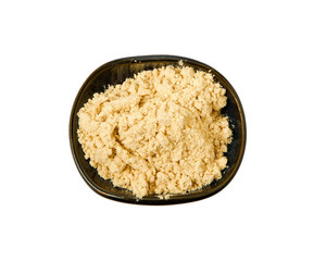 Ginger powder on isolated on a white background. View from above. Flat lay.