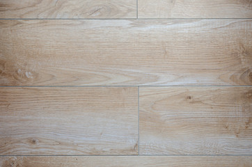 Beige and brown floor tiles with wooden look – suitable as a background