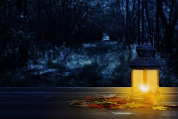 glowing lantern with fall leaves