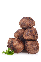 stack of homemade cooked meatballs on white