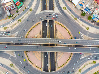Aerial top view circular junction city transport road with car movement