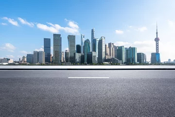 Fotobehang city skyline with empty road © THINK b