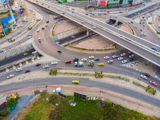 Aerial top view circular junction city transport road with car movement