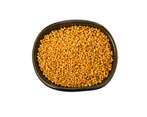 Mustard seeds in a bowl isolated on a white background. Seasoning on isolate. View from above.