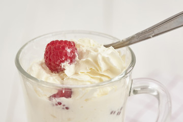 Whipped cream with fresh berry. Close up